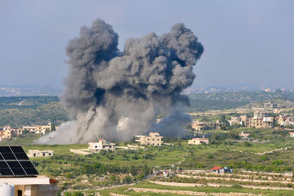 TOPSHOT - Smoke billows from the site of an Israeli airstrike on the southern Lebanese village of Majdel Zoun, on April 15, 2024, amid ongoing cross-border tensions as fighting continues between Israel and Palestinian Hamas militants in the Gaza Strip.
