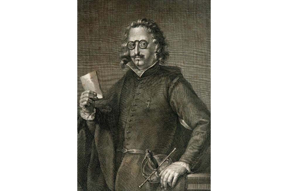 Retrato de Francisco de Quevedo. El escritor tiene gafas y un papel en su mano derecha.