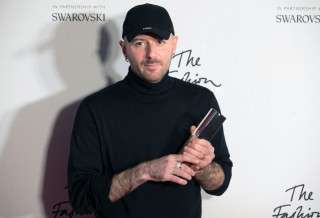 (FILES) Designer Demna Gvasalia of fashion house Balenciaga poses with his  award after being named winner of the International Ready-to-Wear Designer award during the British Fashion Awards 2016 in London on December 5, 2016.