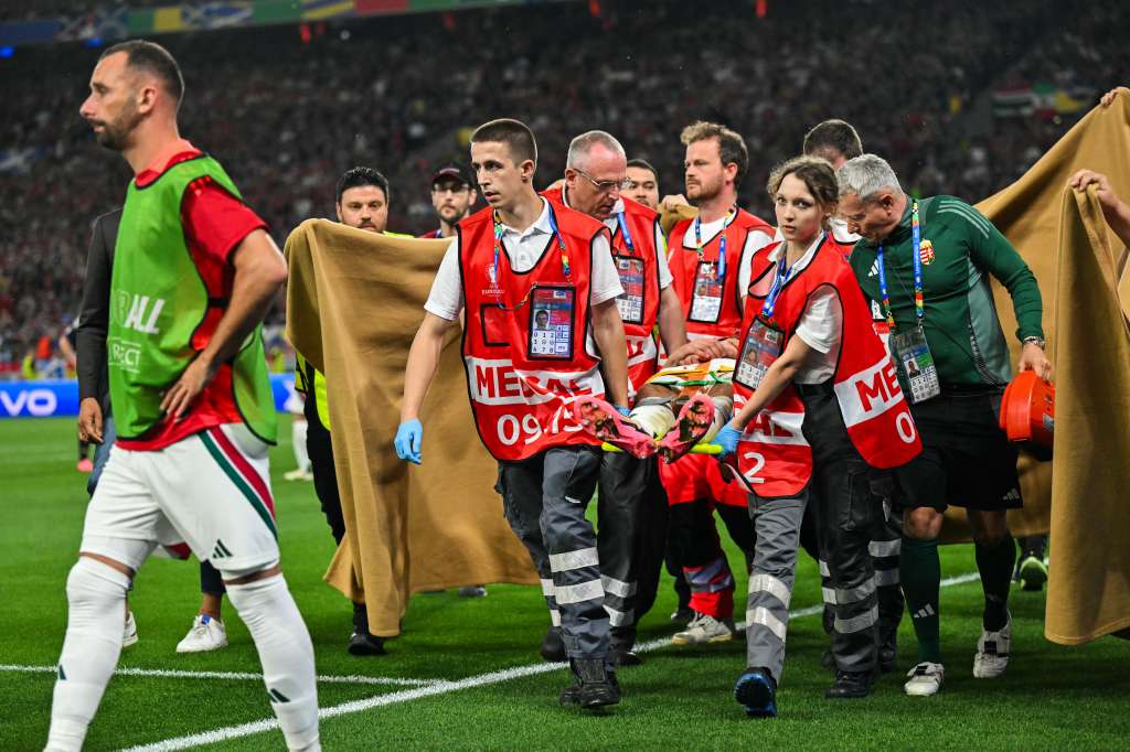 Hungary's forward #19 Barnabas Varga (C) is evacuated on a stretcher after getting injured during the UEFA Euro 2024 Group A football match between Scotland and Hungary at the Stuttgart Arena in Stuttgart on June 23, 2024. (Photo by Miguel MEDINA / AFP)