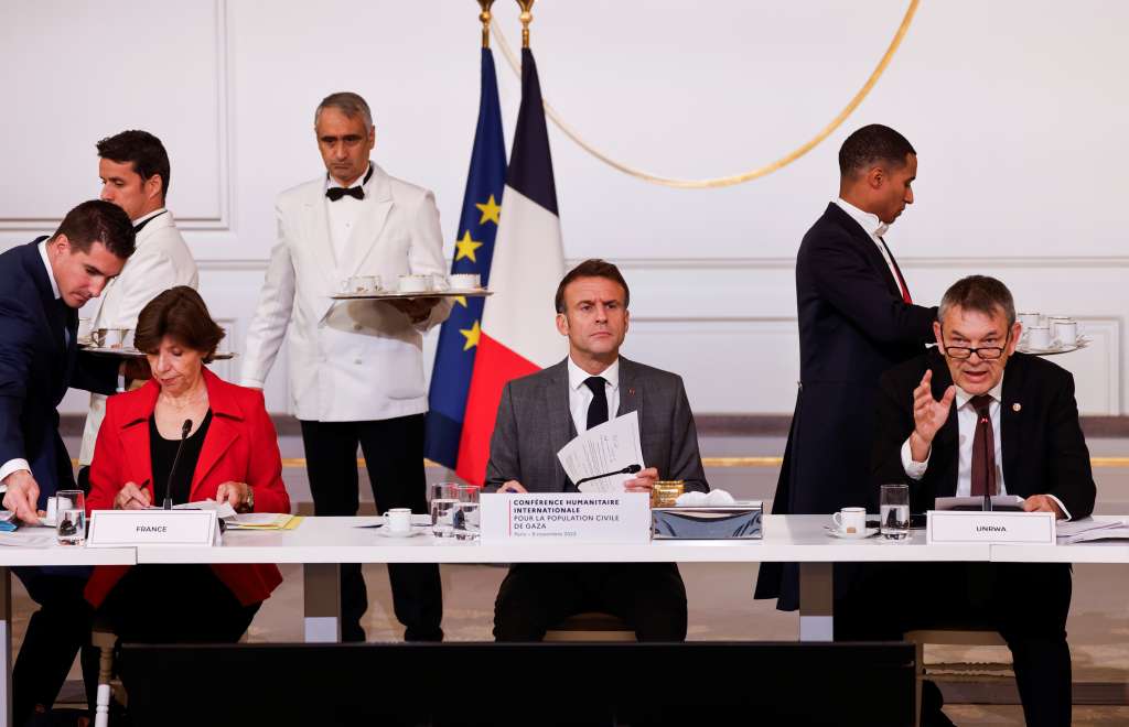Paris (France), 09/11/2023.- (L-R) French Foreign and European Affairs Minister Catherine Colonna, French President Emmanuel Macron and Commissioner General of UNRWA Philippe Lazzarini attend an international humanitarian conference for the civilian population in Gaza, at the Elysee Presidential Palace in Paris, France, 09 November 2023. Key international players will gather at the conference to determine a concrete plan of action to support civilians in Gaza. Thousands of Israelis and Palestinians have died since the militant group Hamas launched an unprecedented attack on Israel from the Gaza Strip on 07 October, and the Israeli strikes on the Palestinian enclave which followed it. (Francia) EFE/EPA/LUDOVIC MARIN / POOL MAXPPP OUT