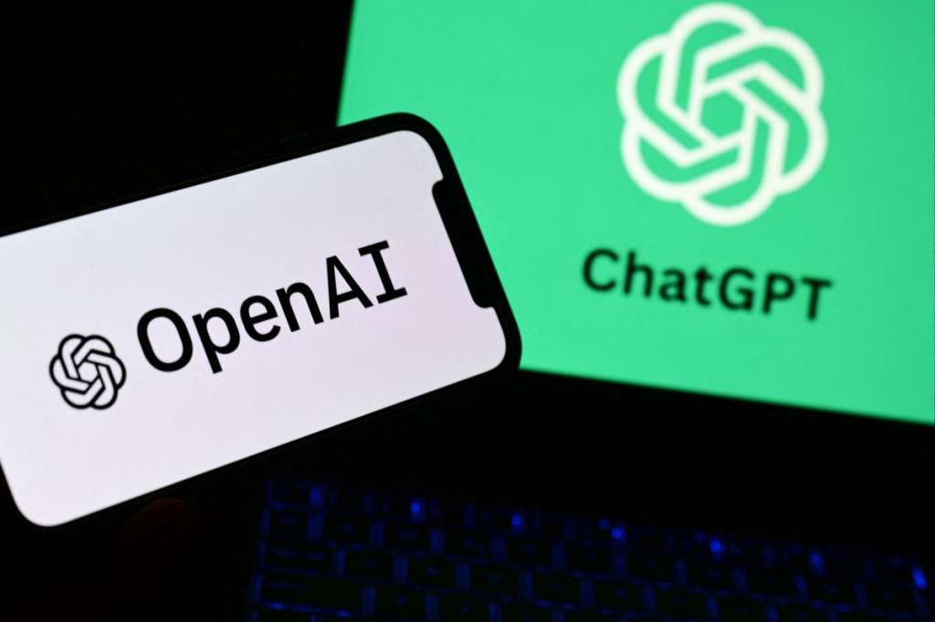 (FILES) A photo taken on October 4, 2023 in Manta, near Turin, shows a smartphone and a laptop displaying the logos of the artificial intelligence OpenAI research laboratory and ChatGPT robot.