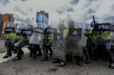 Asesinan e incineran a dos policías venezolanos en Caracas