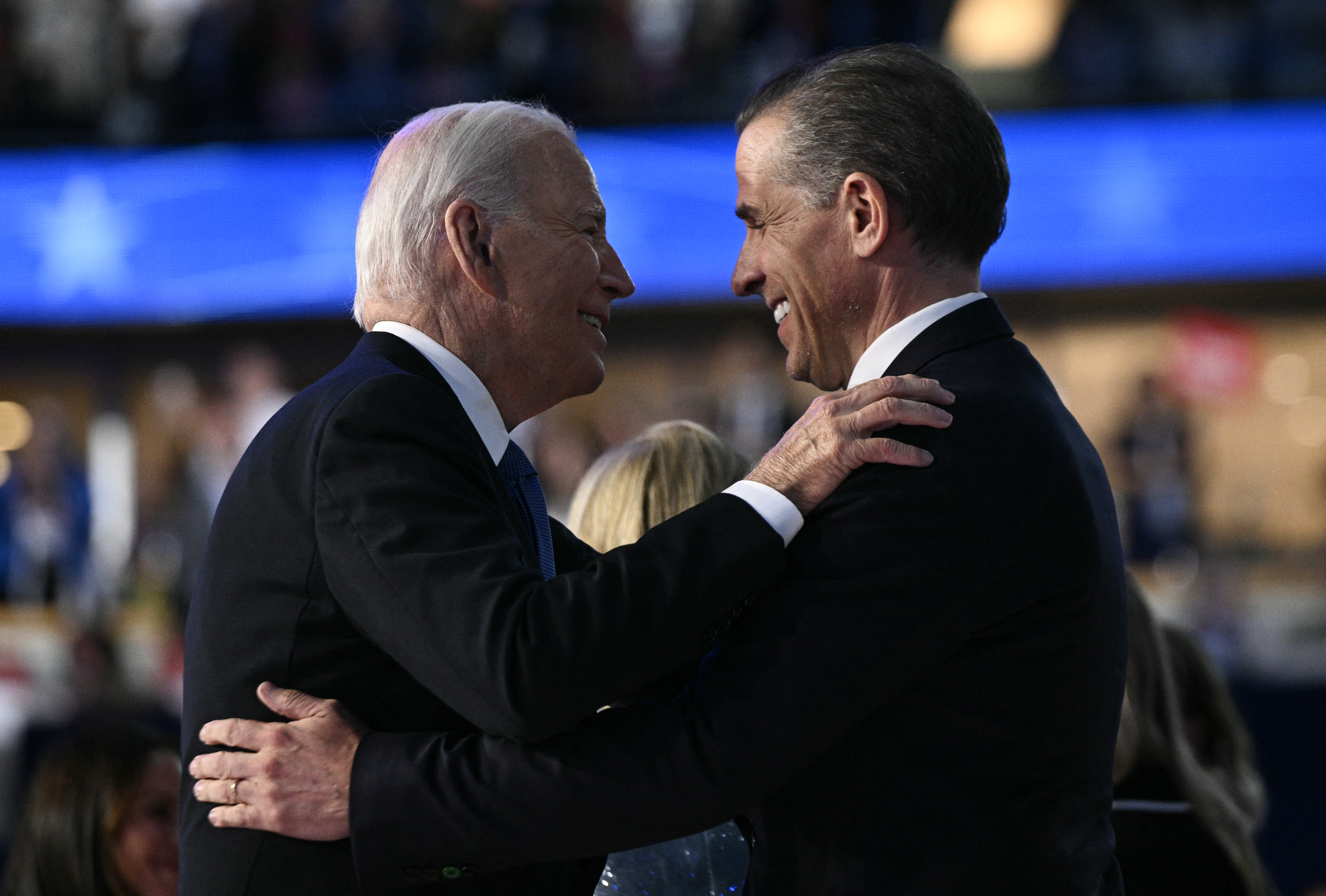(FILES) US President Joe Biden and his son Hunter Biden hug on stage at the conclusion of the first day of the Democratic National Convention (DNC) at the United Center in Chicago, Illinois, on August 19, 2024.