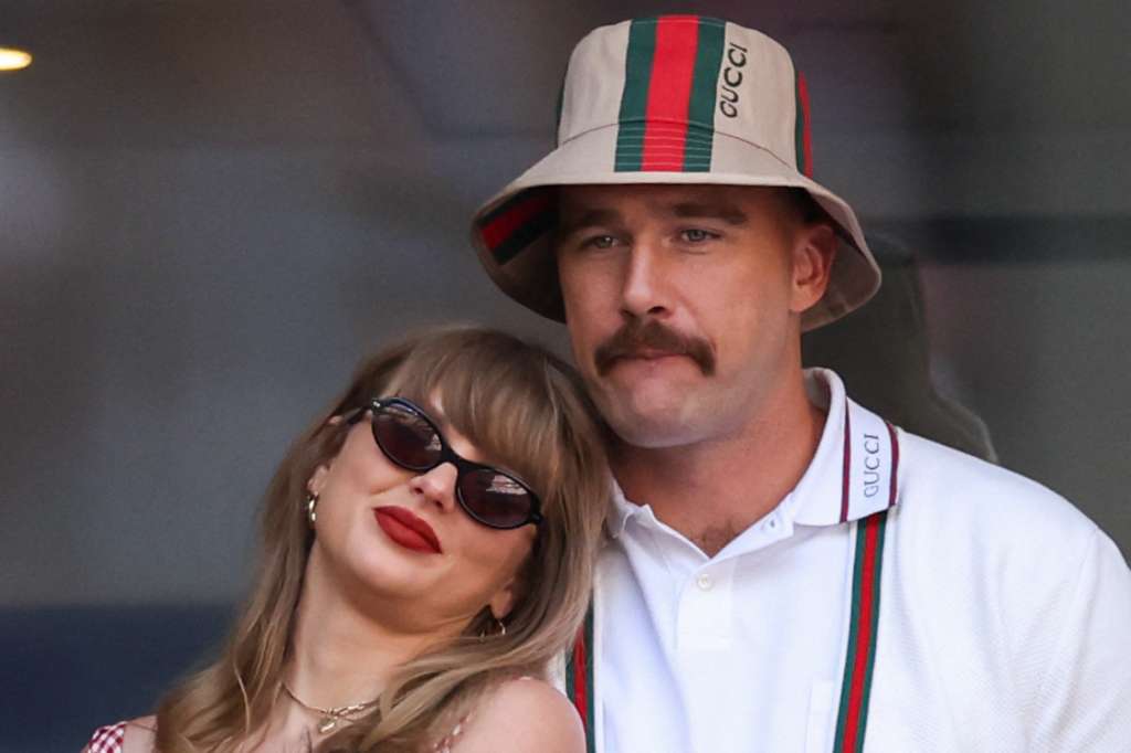 (FILES) US musician Taylor Swift (L) and US NFL football player Travis Kelce (R) attend the men's final match between Italy's Jannik Sinner and USA's Taylor Fritz on day fourteen of the US Open tennis tournament at the USTA Billie Jean King National Tennis Center in New York City, on September 8, 2024. Pop superstar Taylor Swift and American football player Travis Kelce announced their engagement on August 26, 2025, setting the stage for a high-profile wedding for the celebrity couple. A joint post on their Instagram pages showed pictures of Kelce on one knee making his marriage proposal in a flower-laden garden, and then Swift, 35, displaying a large diamond ring. (Photo by CHARLY TRIBALLEAU / AFP)