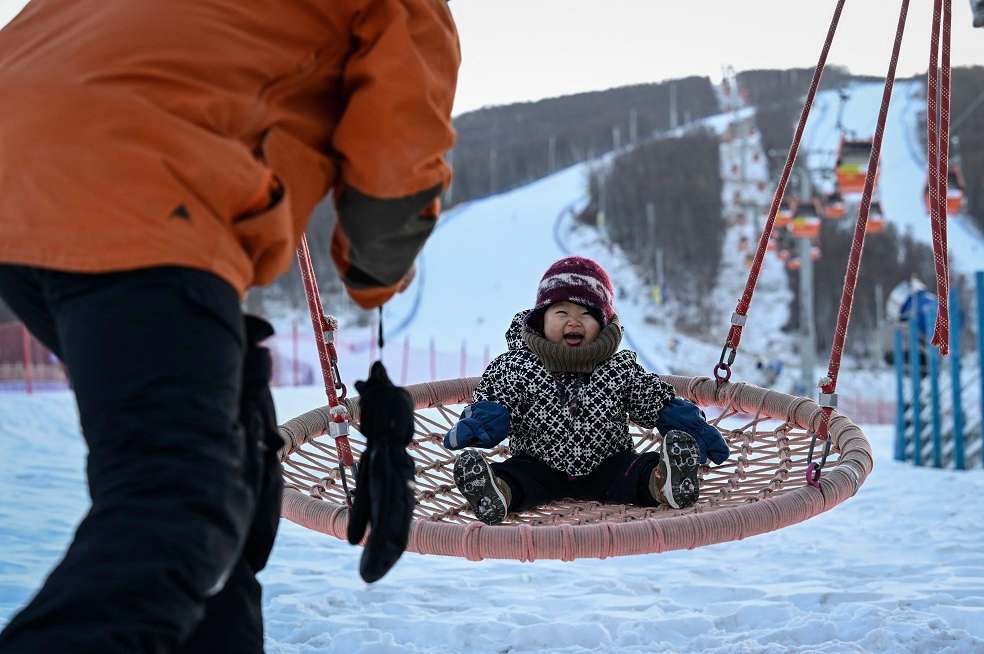 Bebé snowboarding