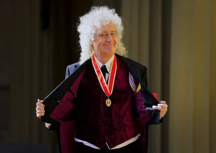 Brian May fue nombrado Caballero de la Orden del Imperio Británico, ¿por qué?