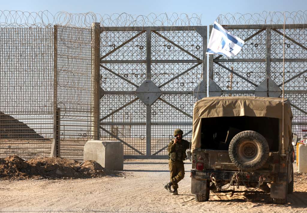Erez Crossing (Israel), 11/11/2024.- An Israeli soldier stands guard beside the border gate of the Erez crossing, on the border with northern Gaza Strip, in southern Israel, 11 November 2024. According to the Israeli Army (Tsahal) and Coordination of Government Activities in the Territories (COGAT), 40 World Food Programme (WFP) aid trucks crossed into the northern Gaza Strip from Israel. According to the United Nations over 1.8 million people in Gaza face extreme hunger. EFE/EPA/VASSIL DONEV