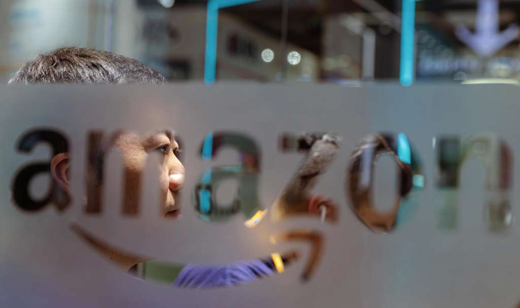 Shanghai (China), 07/11/2022.- A man sits at the Amazon company booth during the China International Import Expo in Shanghai, China, 07 November 2022. The China International Import Expo (CIIE) will be held in Shanghai from 05 to 10 November 2022. EFE/EPA/ALEX PLAVEVSKI