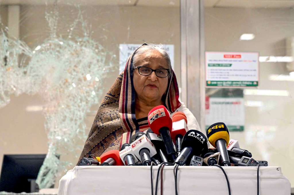 (FILES) In this handout photograph taken and released on July 25, 2024 by Bangladesh Prime Minister's Office, Prime Minister Sheikh Hasina addresses the media at a vandalized metro station in Mirpur, after the anti-quota protests.