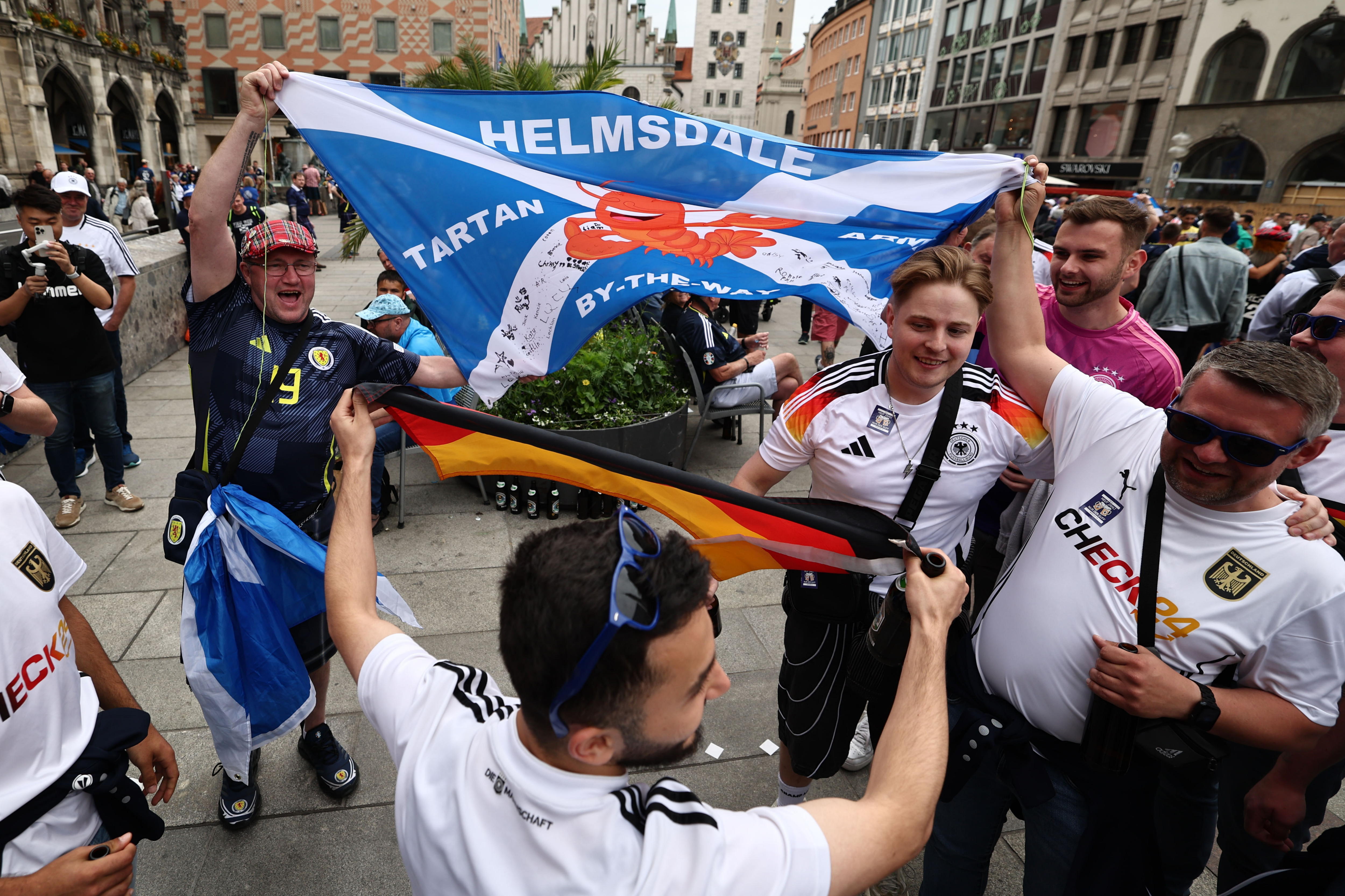 Munich (Germany), 14/06/2024.- Fans of Scotland and Germany gather in the Marienplatz (Mary's Square) in Munich, Germany, 14 June 2024, before the UEFA EURO 2024 opening match between Germany and Scotland in Munich. (Alemania) EFE/EPA/ANNA SZILAGYI