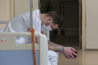 (FILES) A medic takes a break at the emergency department of the Louis Pasteur Hospital in Colmar, eastern France, on March 26, 2020, on the tenth day of a strict lockdown aimed at curbing the spread of the COVID-19 (novel coronavirus).