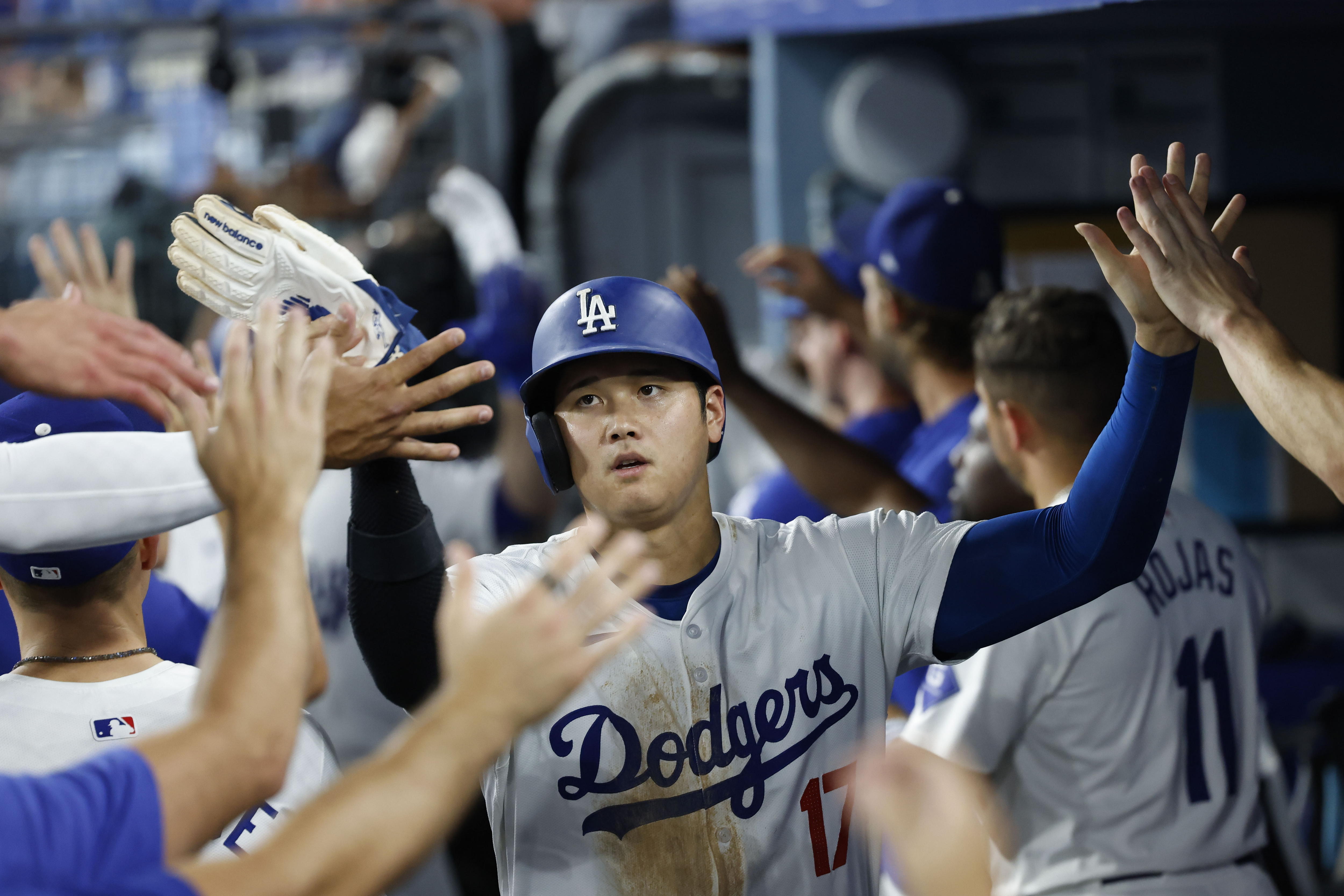 Inglewood (United States), 10/09/2024.- Los Angeles Dodgers designated hitter Shohei Ohtani is greeted by teammates after scoring during the seventh inning of the Major League Baseball (MLB) game between the Chicago Cubs and the Los Angeles Dodgers in Los Angeles, California, USA, 09 September 2024. EFE/EPA/CAROLINE BREHMAN