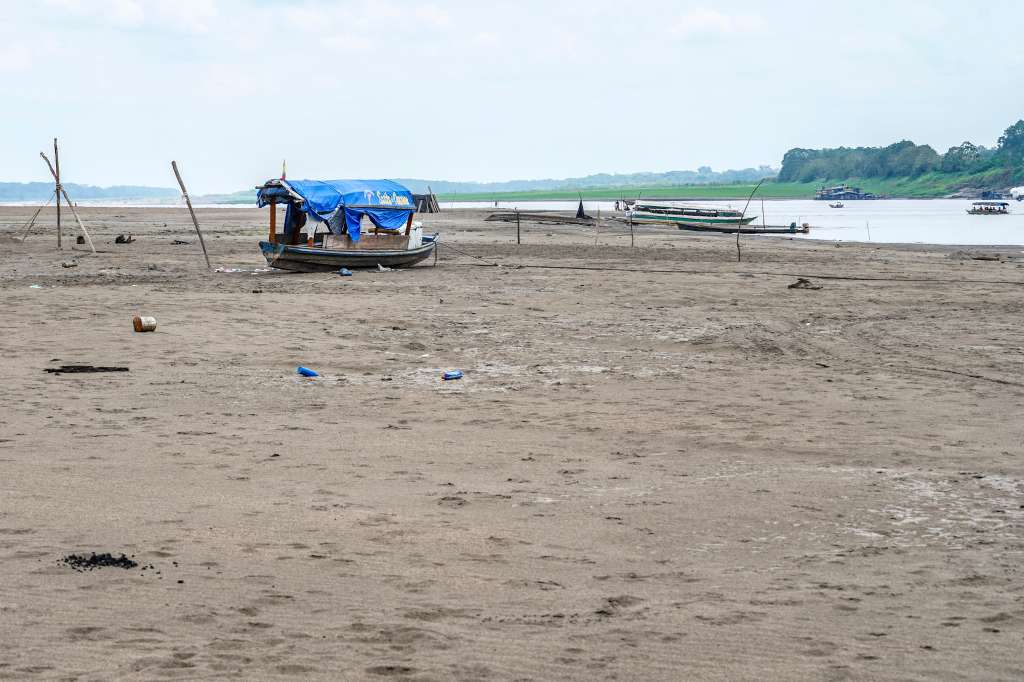 TOPSHOT - Boats remain stranded by the low water level of the Amazon River near the city of Leticia, Amazonas department, on September 15, 2024