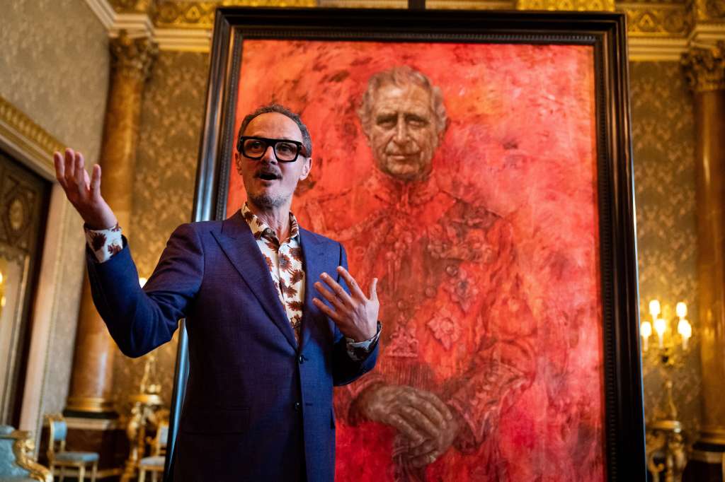 Artist Jonathan Yeo stands in front of his official portrait of Britain's King Charles III wearing the uniform of the Welsh Guards, of which he was made Regimental Colonel in 1975, in the Blue Drawing Room at Buckingham Palace in London on May 14, 2024.