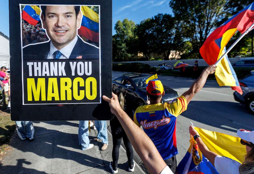 MIAMI (United States), 03/01/2026.- Venezuelans in Miami hold a picture of US Secretary of State Marco Rubio while taking part in a rally in response to the US military strikes in Venezuela, Miami, Florida, USA, 03 January 2026. President Trump announced that US forces have successfully captured Venezuelan President Nicolas Maduro and his wife during a series of large-scale strikes on Caracas on 03 January 2026. EFE/EPA/CRISTOBAL HERRERA-ULASHKEVICH