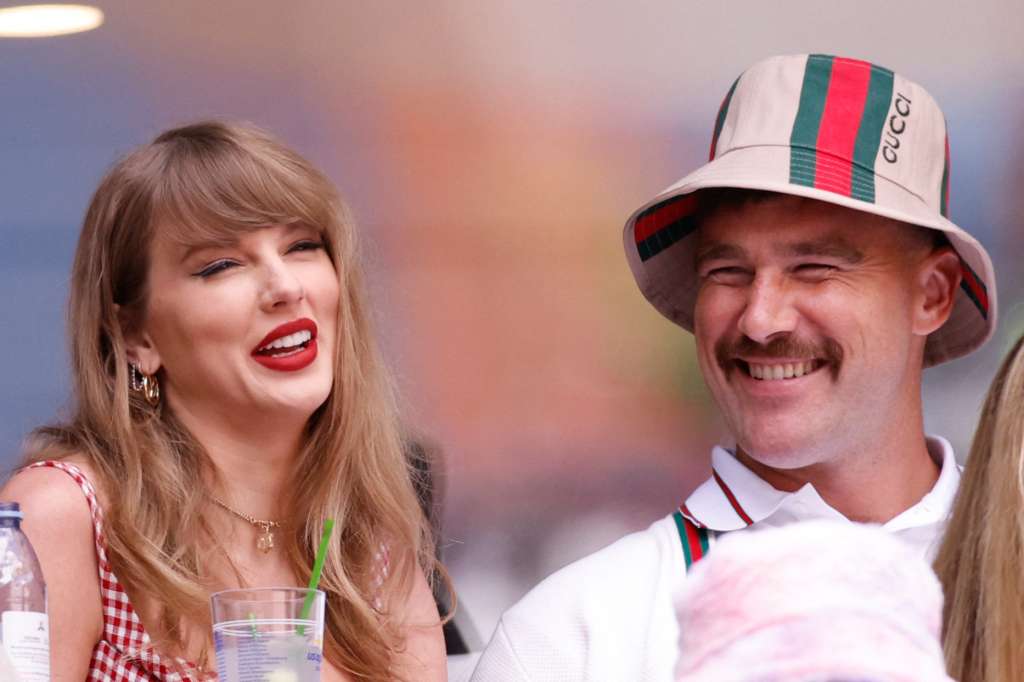 (FILES) US singer-songwriter Taylor Swift (L) and boyfriend US NFL football player Travis Kelce attend the men's final match between USA's Taylor Fritz and Italy's Jannik Sinner on day fourteen of the US Open tennis tournament at the USTA Billie Jean King National Tennis Center in New York City, on September 8, 2024. Pop superstar Taylor Swift and American football player Travis Kelce announced their engagement on August 26, 2025, setting the stage for a high-profile wedding for the celebrity couple. A joint post on their Instagram pages showed pictures of Kelce on one knee making his marriage proposal in a flower-laden garden, and then Swift, 35, displaying a large diamond ring. (Photo by Kena Betancur / AFP)