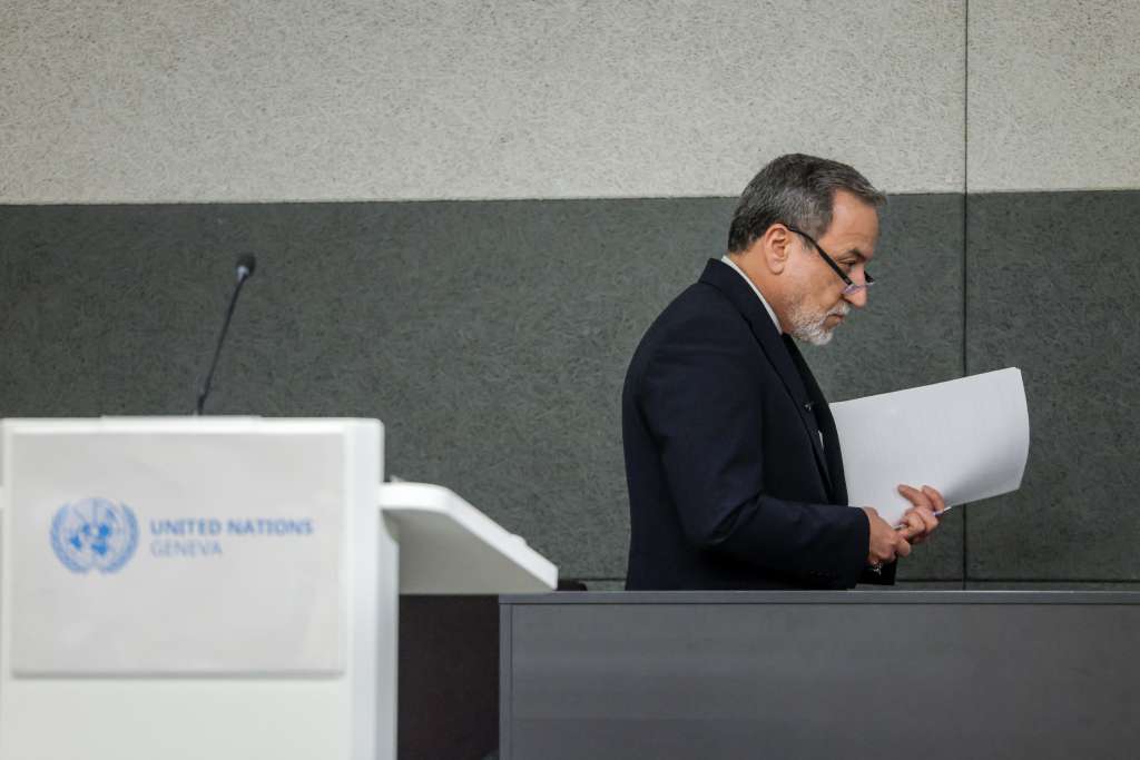 Iran's Foreign Minister Abbas Araghchi leaves after delivering a speech during a session of the United Nations Conference on Disarmament, on the sideline of a second round of US-Iranian talks with Washington pushing Tehran to make a deal to limit its nuclear programme, in Geneva, on February 17, 2026. (Photo by Valentin Flauraud / AFP)