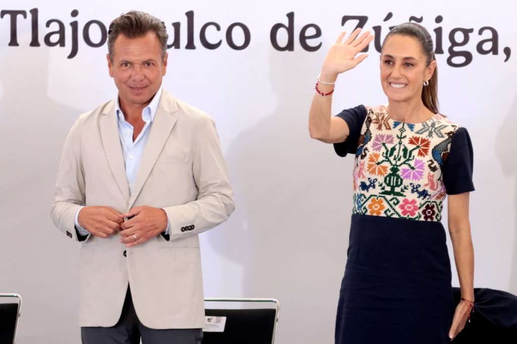 (FILES) Mexico's President Claudia Sheinbaum waves next to the Governor of Jalisco, Pablo Lemus, during the inauguration of the first phase of the Tlajomulco Regional Hospital in Tlajomulco de Zuñiga, Jalisco state, Mexico on August 8, 2025.