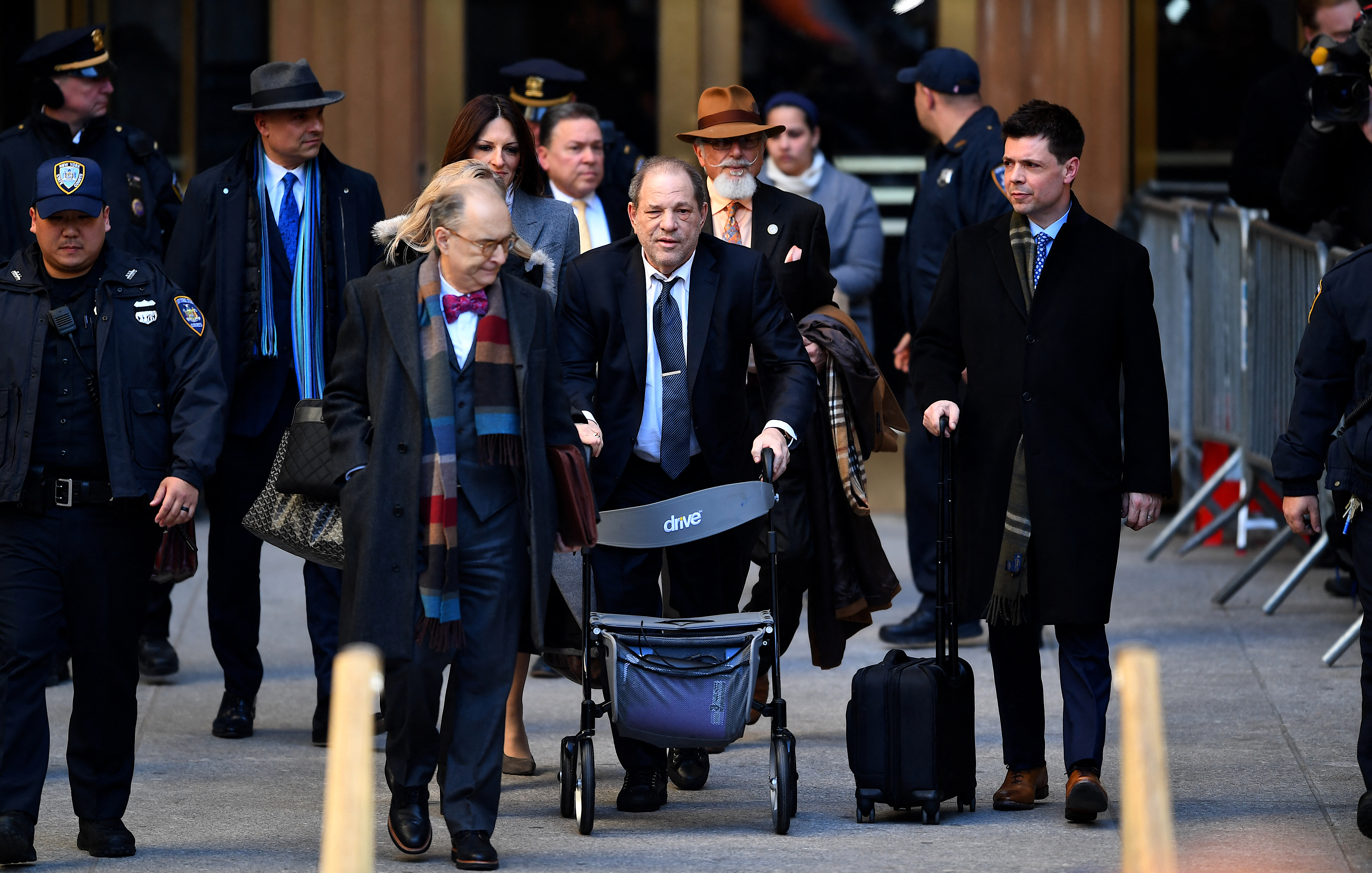 (FILES) Harvey Weinstein leaves the Manhattan Criminal Court, as a jury continues with deliberations on February 21, 2020, in New York City.