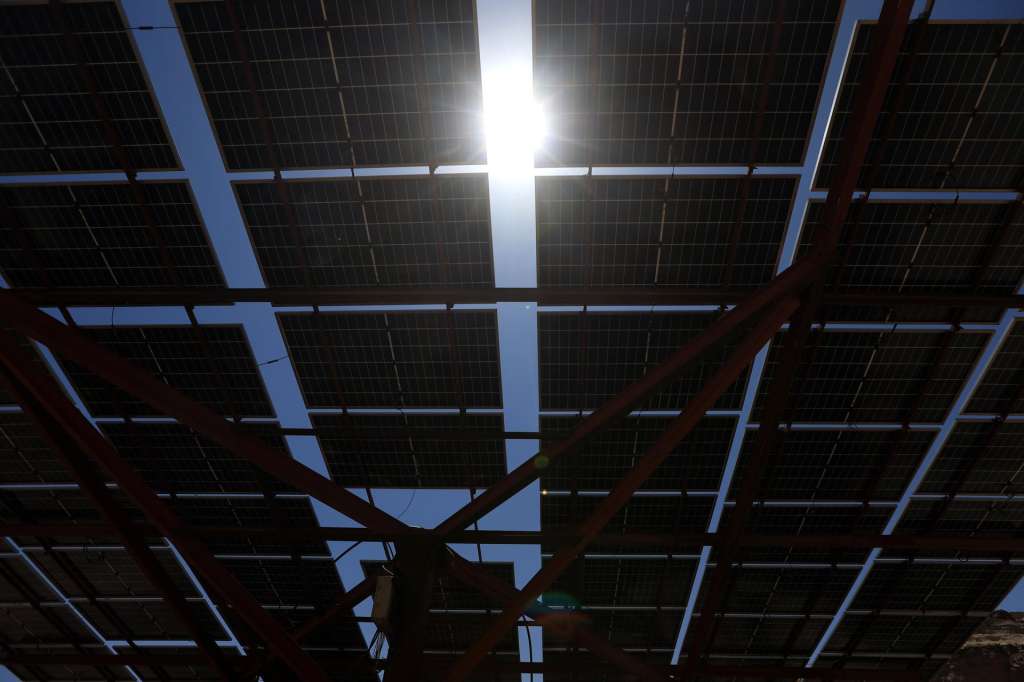 SANA'A (Yemen), 22/04/2025.- The Sun's light breaks through an array of solar power panels on Earth Day, at a valley in Sana'a, Yemen, 22 April 2025. Earth Day is celebrated annually on 22 April, with this year's theme being 'Our Power, Our Planet'. EFE/EPA/YAHYA ARHAB