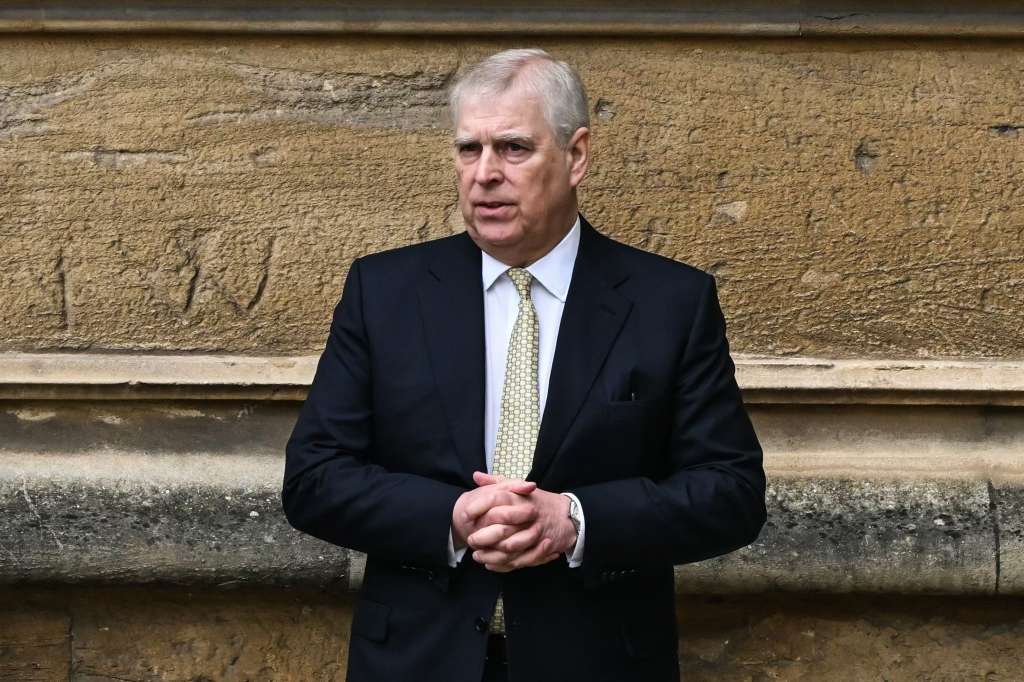 (FILES) Britain's Prince Andrew, Duke of York reacts as he arrives at St. George's Chapel, Windsor Castle, to attend the Easter Mattins Service, on March 31, 2024. - A former UK security minister said Friday, december 13, that it was "extremely embarrassing" that a suspected Chinese spy had become a confidant of disgraced royal Prince Andrew. (Photo by JUSTIN TALLIS / AFP)
