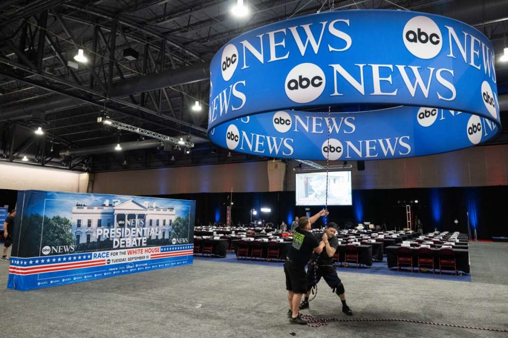 (FILES) Workers complete preparations on the media filing center and spin room for the ABC News Presidential Debate between Democratic candidate Vice President Kamala Harris and Republican candidate former US President Donald Trump, in Philadelphia, Pennsylvania, September 9, 2024.
