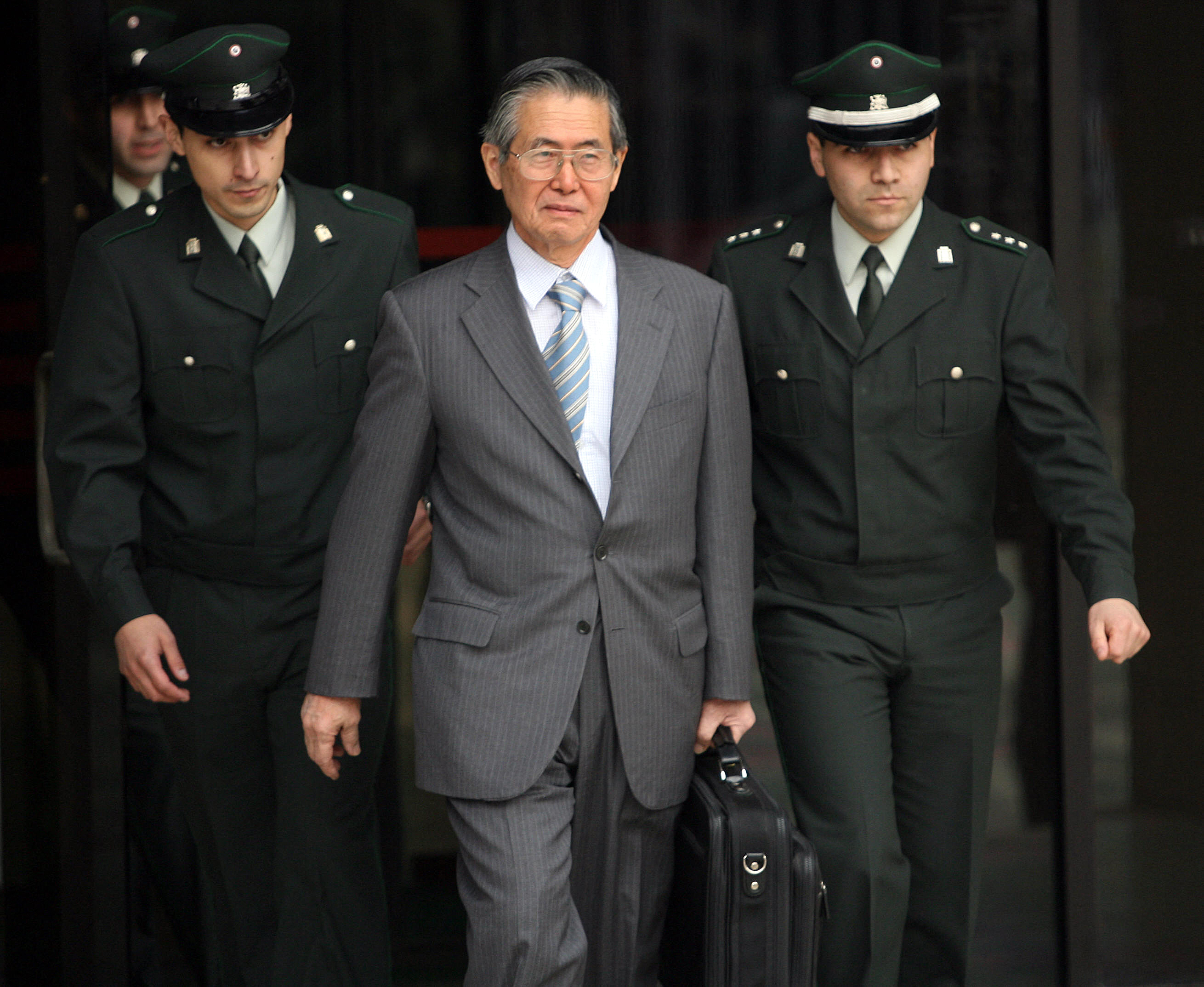 (FILES) Former Peruvian president Alberto Fujimori walks out of jail 18 May 2006 in Santiago, after posting bail.