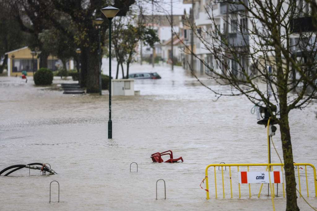 Chairs are pictured floating in a flooded street of Alcacer do Sal, south of Portugal, during Leonardo storm on February 4, 2026. The Iberian peninsula on February 4, 2026 braced for a violent storm, with southern Spain shutting schools and Portugal placed on fresh alert after severe weather killed five people last week. (Photo by PATRICIA DE MELO MOREIRA / AFP)