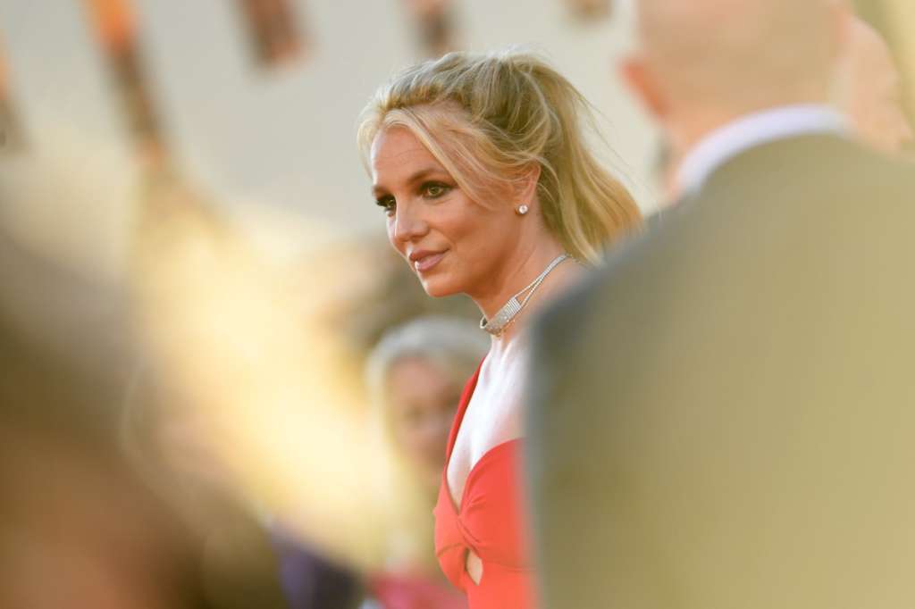 (FILES) US singer Britney Spears arrives for the premiere of Sony Pictures' "Once Upon a Time... in Hollywood" at the TCL Chinese Theatre in Hollywood, California on July 22, 2019. Troubled pop princess Britney Spears admitted to reckless driving involving alcohol on Monday, in a plea deal that means she will avoid jail. The "Toxic" singer was arrested in March after police spotted her driving erratically on a freeway in Ventura County, near Los Angeles. She was initially charged with DUI -- driving under the influence -- but under a plea deal she admitted to a lesser charge of reckless driving involving alcohol, drugs or both. She was sentenced to 12 months probation. (Photo by VALERIE MACON / AFP)