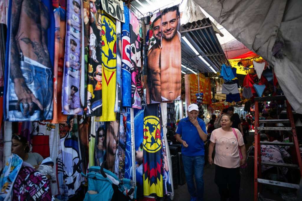 Towels bearing images of Mexico's security secretary Omar Garcia Harfuch are displayed for sale at a market in Mexico City on May 1, 2026.