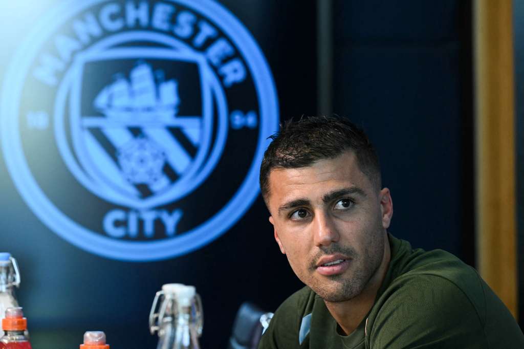 Manchester City's Spanish midfielder #16 Rodri reacts during a press conference at the Manchester City's training ground, in Manchester, north-west England, on September 17, 2024, on the eve of their UEFA Champions League football match against Inter Milan. (Photo by Oli SCARFF / AFP)